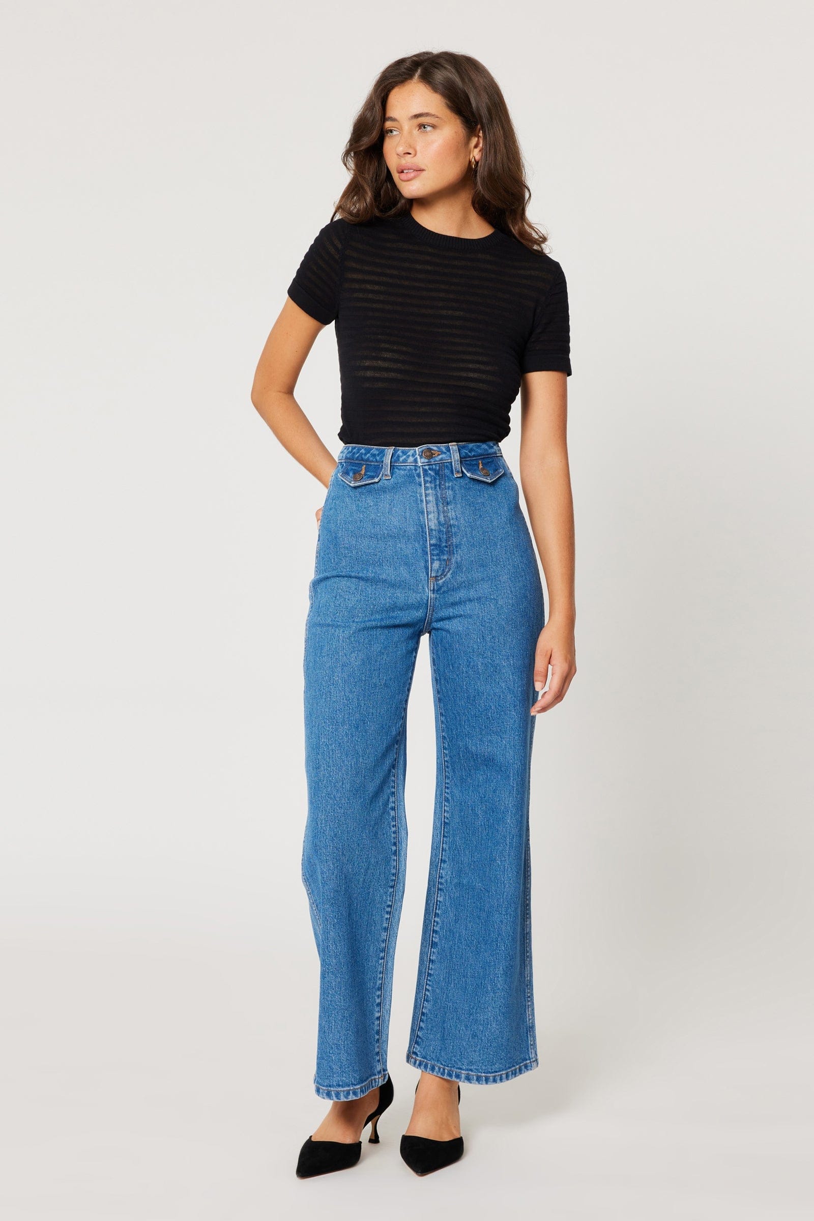 Chic and versatile bottoms collection at a boutique in Austin, Texas, featuring a variety of fashionable items